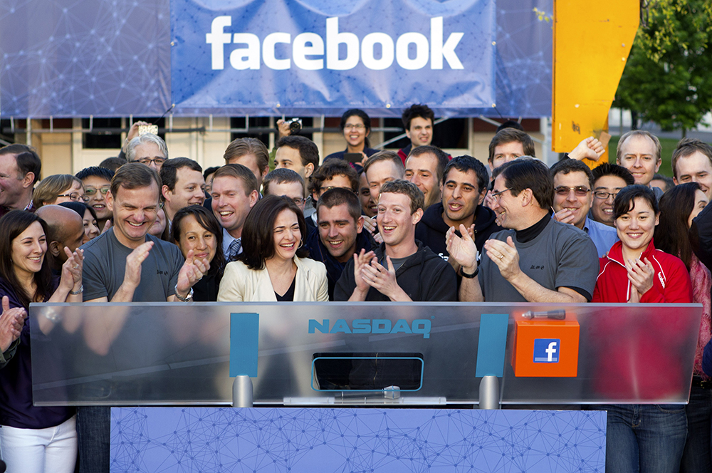 Facebook team with ringing Nasdaq bell